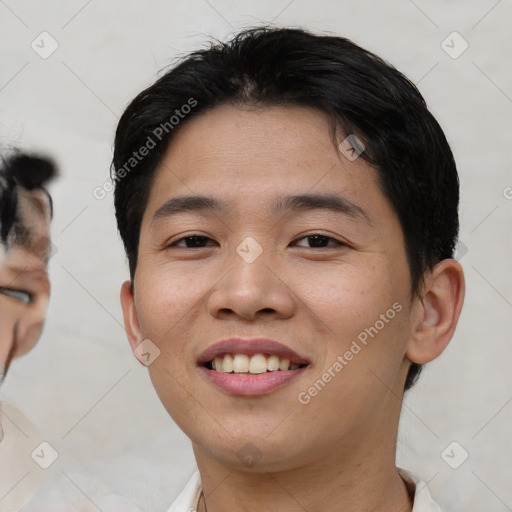 Joyful asian young-adult male with short  black hair and brown eyes