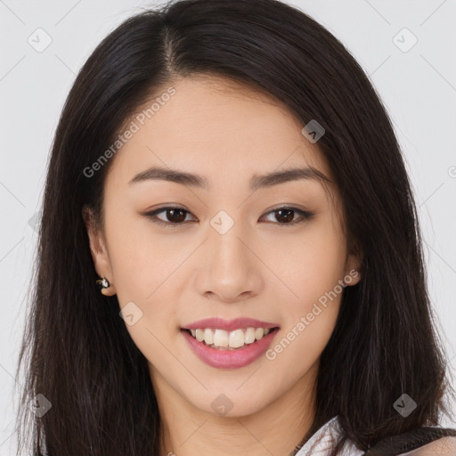 Joyful asian young-adult female with long  brown hair and brown eyes