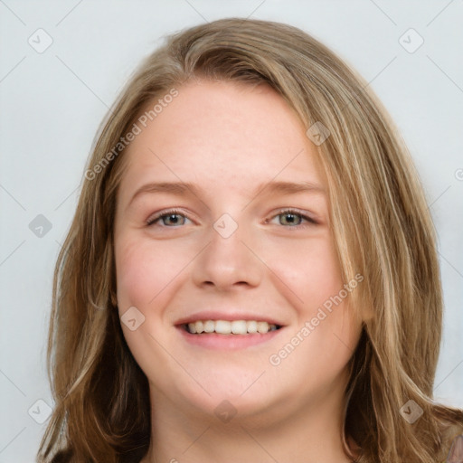 Joyful white young-adult female with long  brown hair and blue eyes