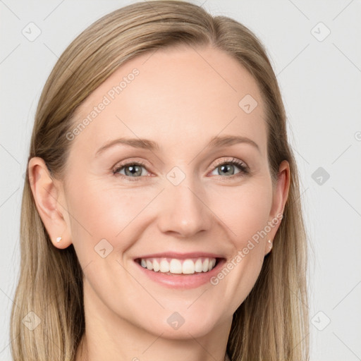 Joyful white young-adult female with long  brown hair and grey eyes