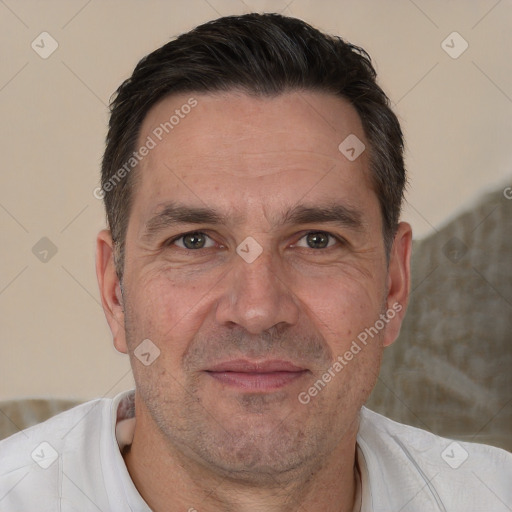 Joyful white adult male with short  brown hair and brown eyes