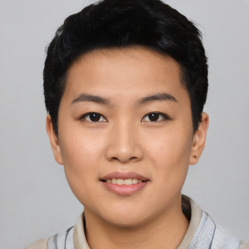 Joyful asian young-adult female with short  black hair and brown eyes