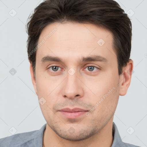 Neutral white young-adult male with short  brown hair and brown eyes