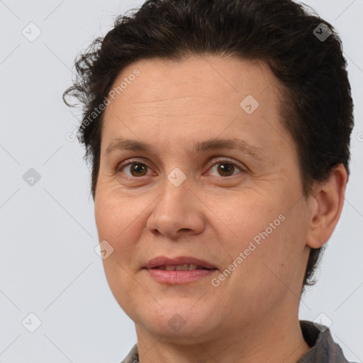 Joyful white adult female with short  brown hair and brown eyes