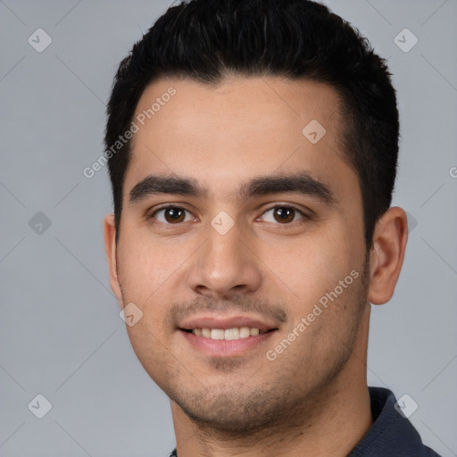 Joyful white young-adult male with short  black hair and brown eyes