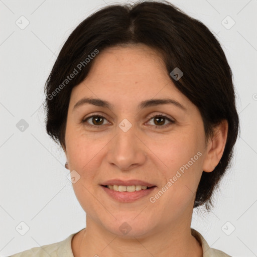 Joyful white adult female with medium  brown hair and brown eyes