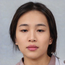 Neutral asian young-adult female with medium  brown hair and brown eyes