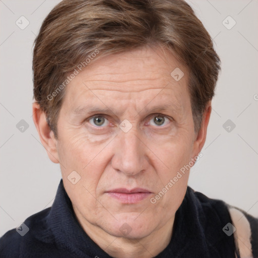 Joyful white adult male with short  brown hair and grey eyes