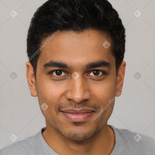 Joyful latino young-adult male with short  black hair and brown eyes