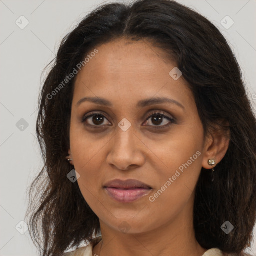 Joyful black adult female with medium  brown hair and brown eyes