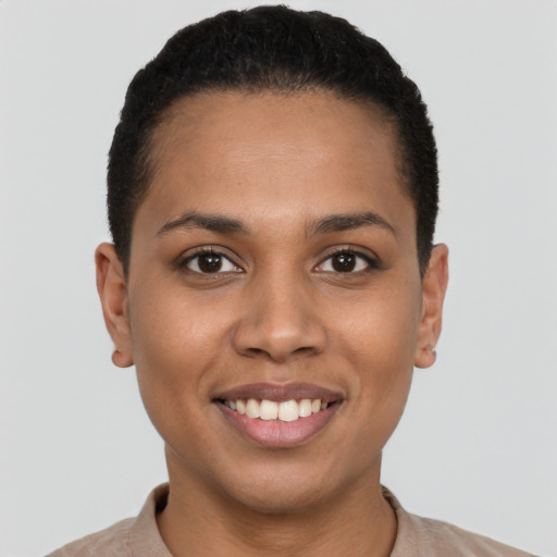 Joyful latino young-adult female with short  black hair and brown eyes