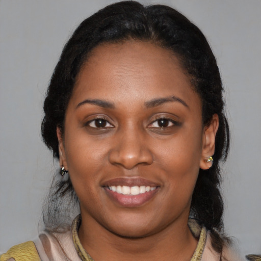 Joyful latino young-adult female with medium  black hair and brown eyes