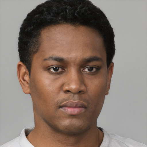 Neutral black young-adult male with short  black hair and brown eyes