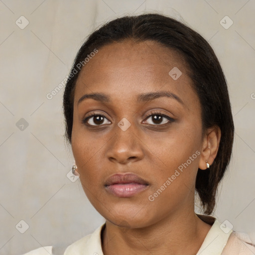 Neutral black young-adult female with medium  brown hair and brown eyes