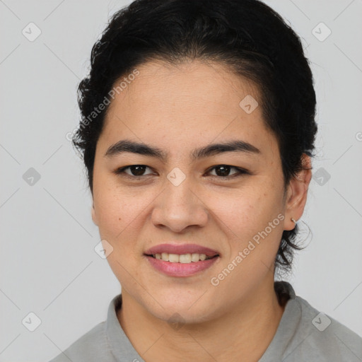 Joyful latino young-adult female with short  brown hair and brown eyes