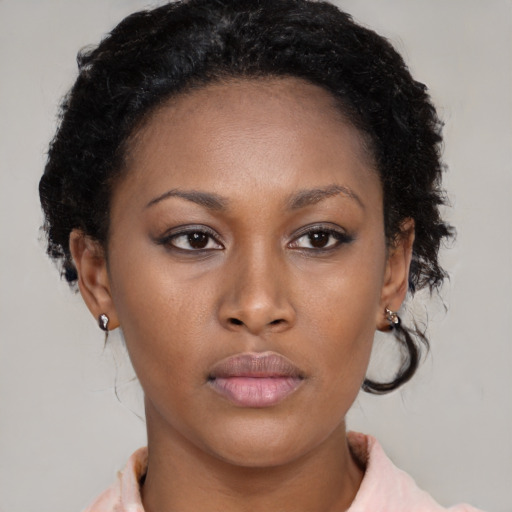 Neutral black young-adult female with medium  brown hair and brown eyes