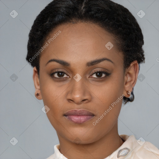 Joyful black young-adult female with short  brown hair and brown eyes