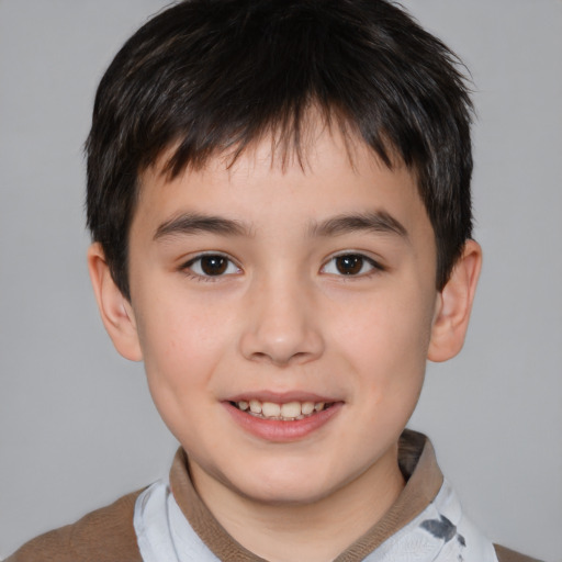 Joyful white child male with short  brown hair and brown eyes