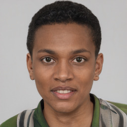 Joyful black young-adult male with short  brown hair and brown eyes