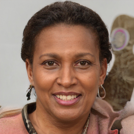 Joyful latino adult female with short  brown hair and brown eyes