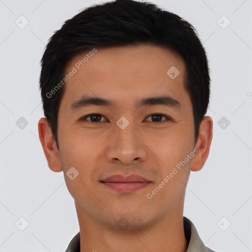 Joyful asian young-adult male with short  black hair and brown eyes