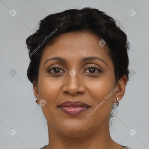 Joyful latino adult female with short  brown hair and brown eyes