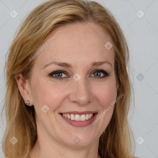 Joyful white adult female with long  brown hair and brown eyes