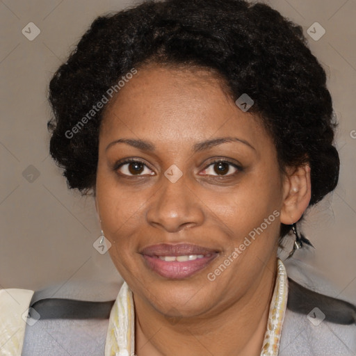 Joyful black adult female with medium  brown hair and brown eyes