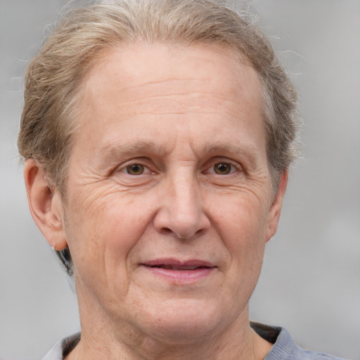 Joyful white middle-aged male with short  gray hair and grey eyes