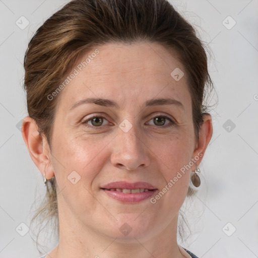 Joyful white adult female with short  brown hair and grey eyes