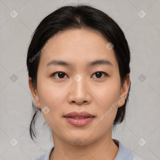 Joyful asian young-adult female with medium  black hair and brown eyes