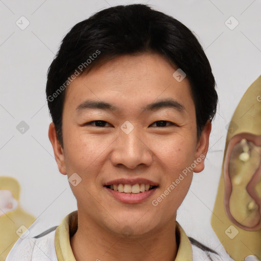 Joyful asian young-adult male with short  black hair and brown eyes