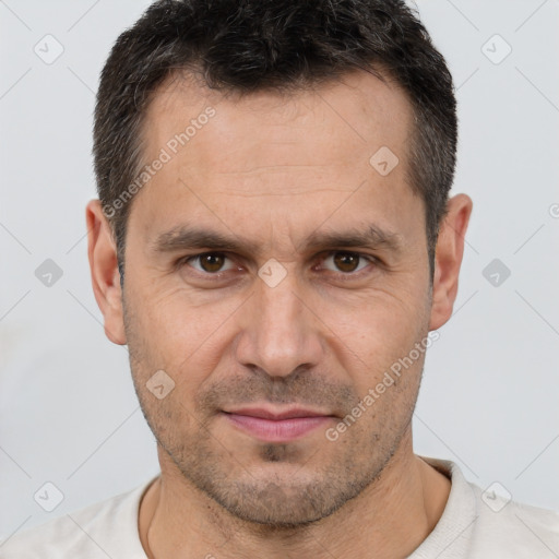 Joyful white adult male with short  brown hair and brown eyes