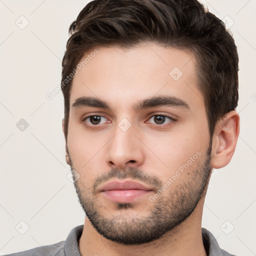 Neutral white young-adult male with short  brown hair and brown eyes