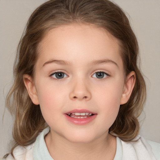 Joyful white child female with medium  brown hair and brown eyes