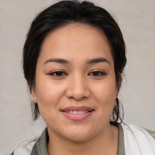 Joyful asian young-adult female with medium  brown hair and brown eyes