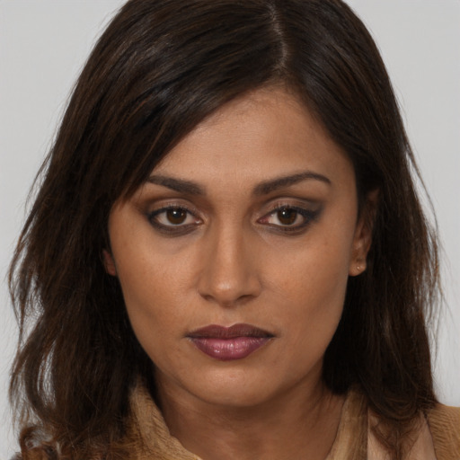 Neutral white young-adult female with long  brown hair and brown eyes