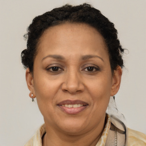 Joyful latino adult female with short  brown hair and brown eyes