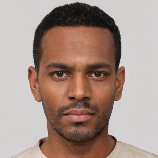 Neutral black young-adult male with short  black hair and brown eyes