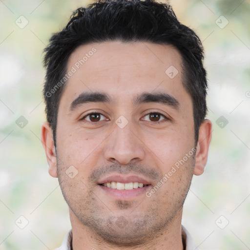 Joyful white young-adult male with short  black hair and brown eyes