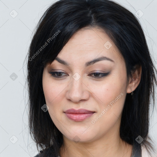 Joyful asian young-adult female with long  brown hair and brown eyes