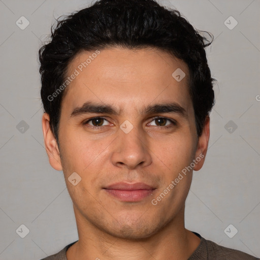 Joyful white young-adult male with short  black hair and brown eyes