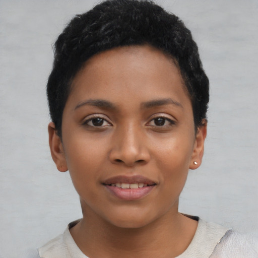 Joyful latino young-adult female with short  black hair and brown eyes