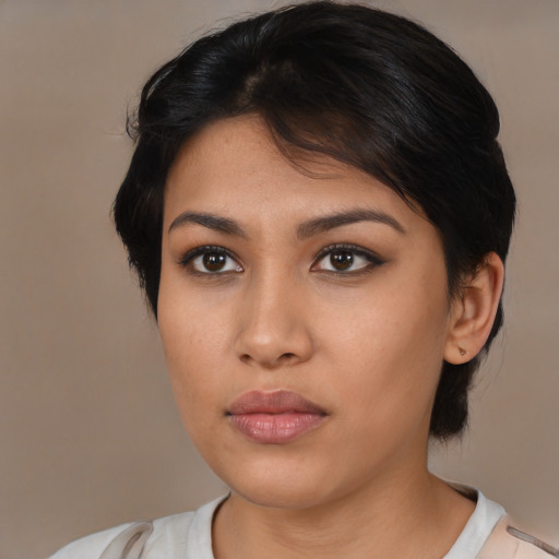 Neutral latino young-adult female with medium  brown hair and brown eyes