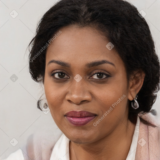 Joyful black young-adult female with long  brown hair and brown eyes