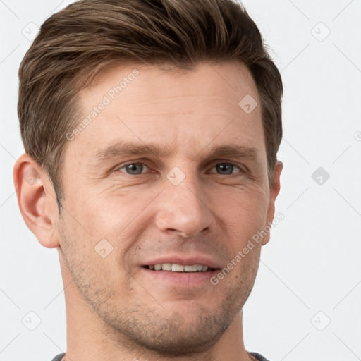 Joyful white adult male with short  brown hair and grey eyes