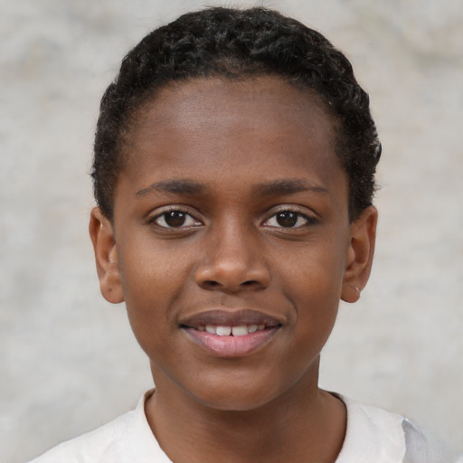 Joyful black child female with short  brown hair and brown eyes