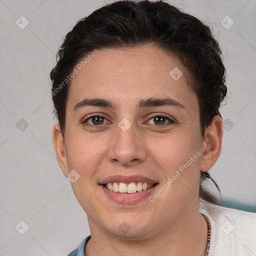 Joyful white young-adult female with short  brown hair and brown eyes