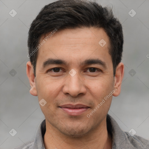 Joyful white adult male with short  black hair and brown eyes