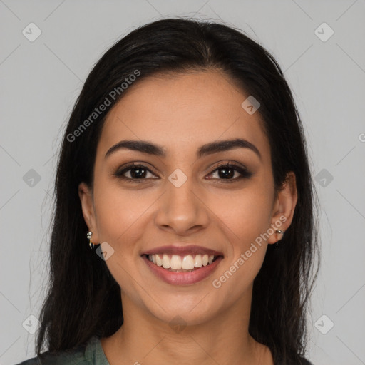 Joyful latino young-adult female with long  brown hair and brown eyes